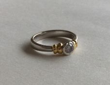 A good quality diamond single stone ring in two co