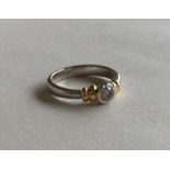 A good quality diamond single stone ring in two co