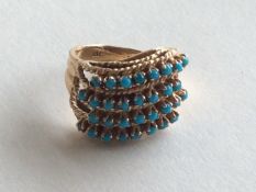 An 18 carat turquoise four row swirl ring with wea