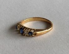 An attractive sapphire and diamond five stone ring