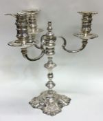 A good quality cast silver candelabra on spreading