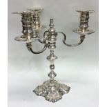 A good quality cast silver candelabra on spreading