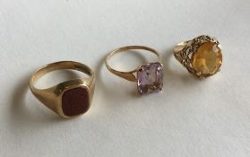 A group of three single stone rings in 9 carat mou