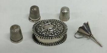 A bag containing silver thimbles, funnels etc. App