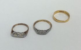 Two 18 carat gold and diamond set rings. Approx. 4