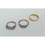 Two 18 carat gold and diamond set rings. Approx. 4