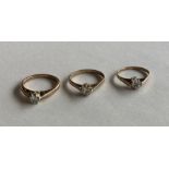 Three 9 carat diamond single stone rings in claw m