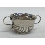 A rare miniature Queen Anne silver porringer with