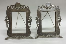 A good pair of Chinese silver picture frames of ty