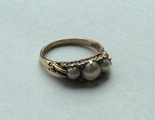 A 9 carat Victorian style pearl and diamond seven