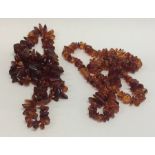 Two graduated strings of amber beads. Approx. 128