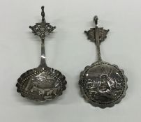 A pair of Continental silver ladles decorated with