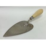 EXETER: A silver engraved trowel with fluted handl