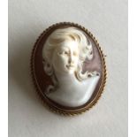 An oval cameo of a lady's head in high relief and