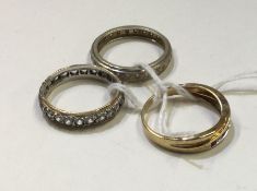 A group of three gold eternity rings Approx. 9.4 g