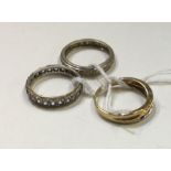 A group of three gold eternity rings Approx. 9.4 g