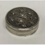 A large circular Chinese silver pill box decorated
