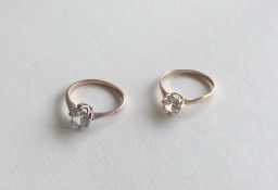 Two 9 carat gold single stone rings in claw mounts