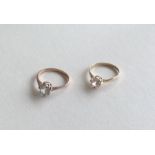 Two 9 carat gold single stone rings in claw mounts