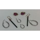 A bag containing 9 carat diamond set earrings. App