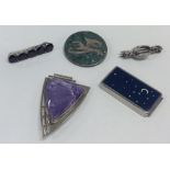 A stylish amethyst and silver brooch etc. Approx.