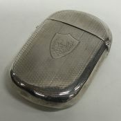 A massive silver cushion shaped card case with eng