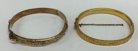 Two 9 carat hinged bangles with engraved decoratio