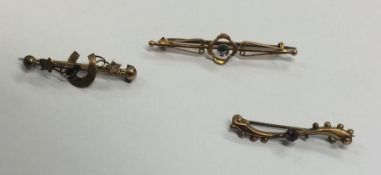 A group of three gold gem set brooches. Approx. 4
