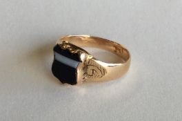 A 9 carat gent's shield shaped signet ring. Approx