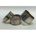 A group of three silver napkin rings. Various date