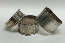 A group of three silver napkin rings. Various date