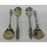 A cased set of four heavy cast apostle top spoons.