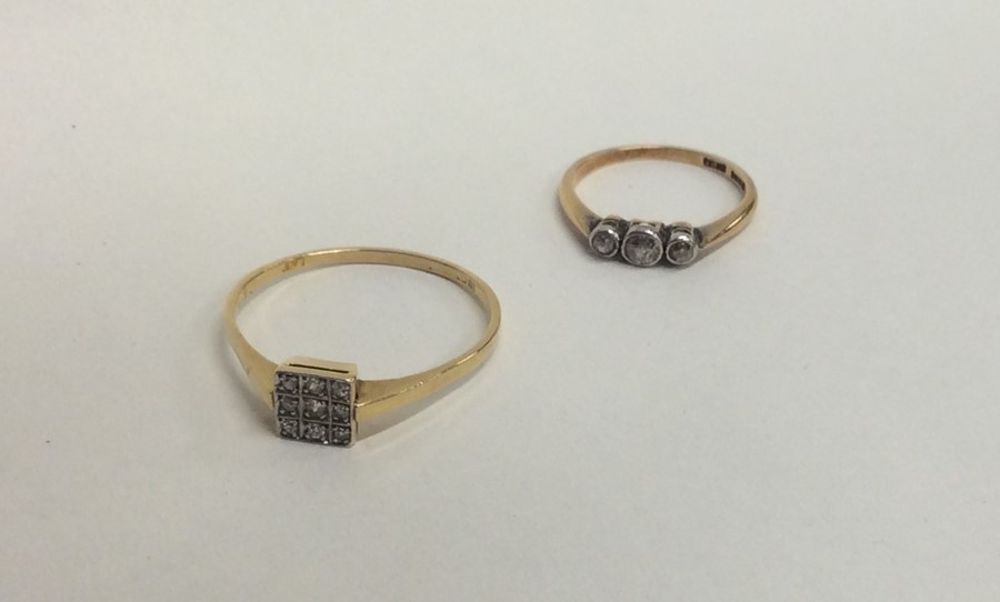 Two diamond mounted rings in 18 carat gold. Approx