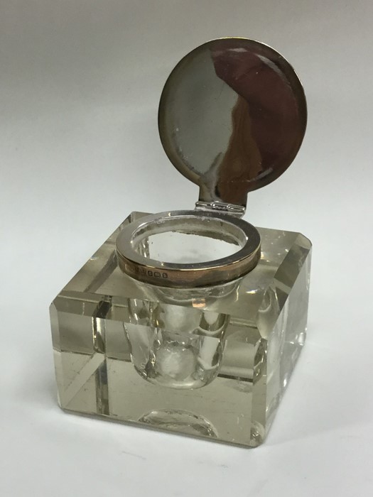 A square silver mounted and glass inkwell with hin