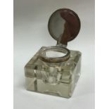 A square silver mounted and glass inkwell with hin