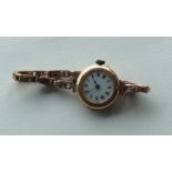 A 9 carat lady's wristwatch on mesh strap. Approx.