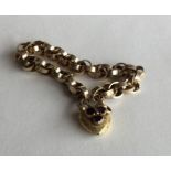 A good Victorian gold bracelet with garnet set pad