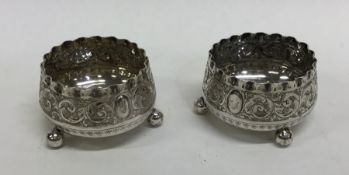 A pair of Edwardian silver salts decorated with sc