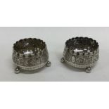 A pair of Edwardian silver salts decorated with sc