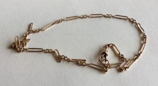 A 9 carat long and short link chain with ring clas