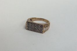 A large gent's diamond 15 stone ring in 9 carat go