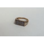 A large gent's diamond 15 stone ring in 9 carat go