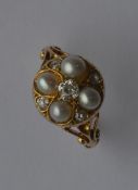 A good Victorian pearl cluster ring with scroll de