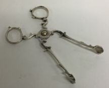 A pair of Georgian silver sugar scissors. London.