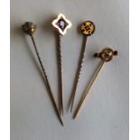 A good group of Victorian gold stick pins set with