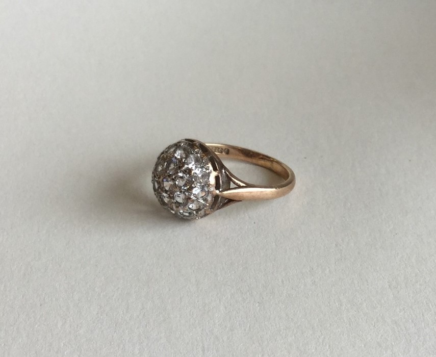 A 9 carat diamond bombe shaped cluster ring. Appro