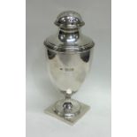 A Georgian style silver caster on square base. Lon