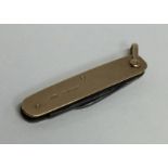 A small 9 carat penknife. Approx. 14 grams. Est. £