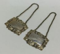 A good pair of silver gilt wine labels attractivel