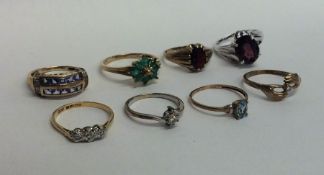 Eight 9 carat gem set rings. Approx. 18.1 grams. E